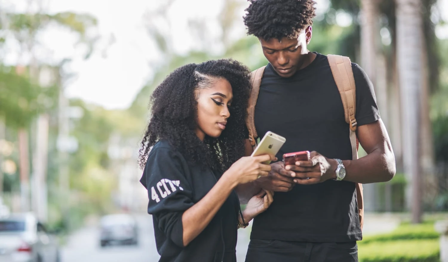 A couple looking at their devices