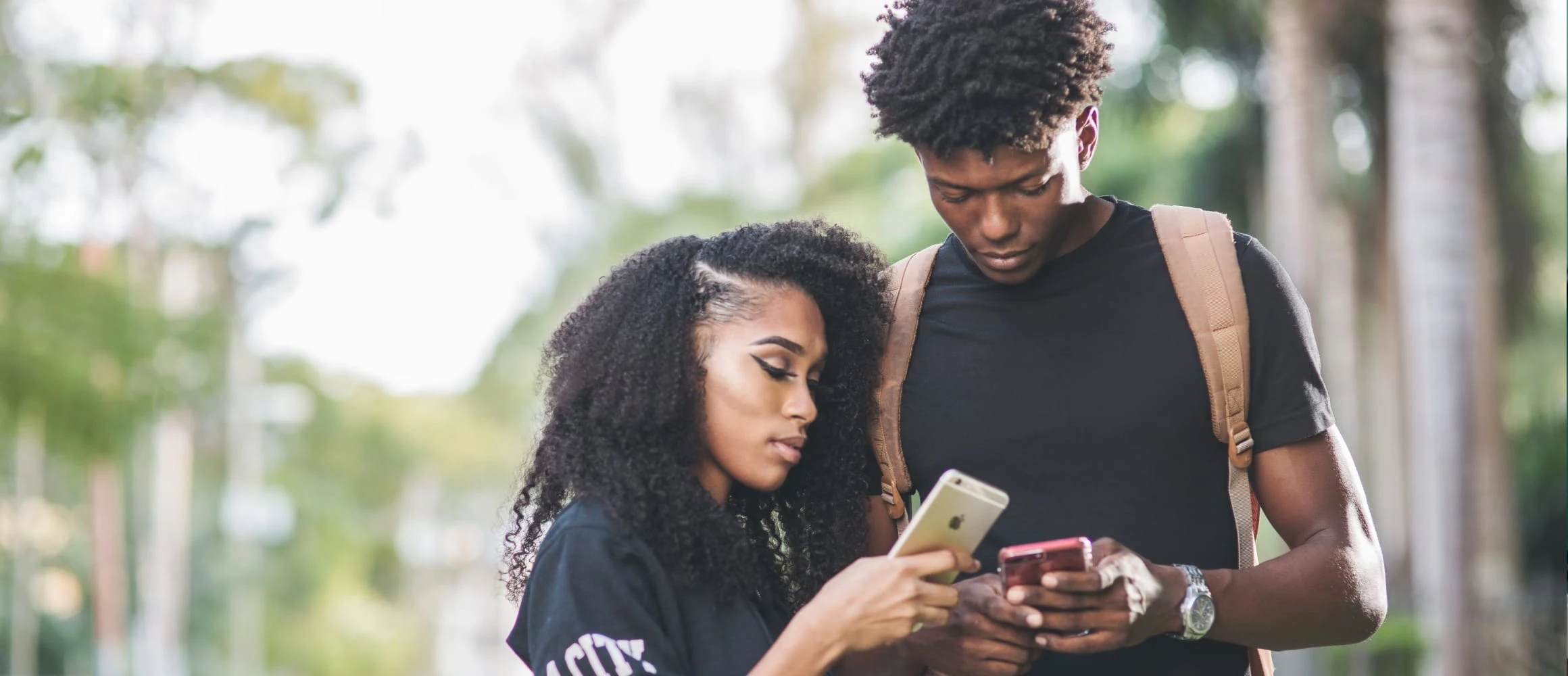 A couple looking at their devices