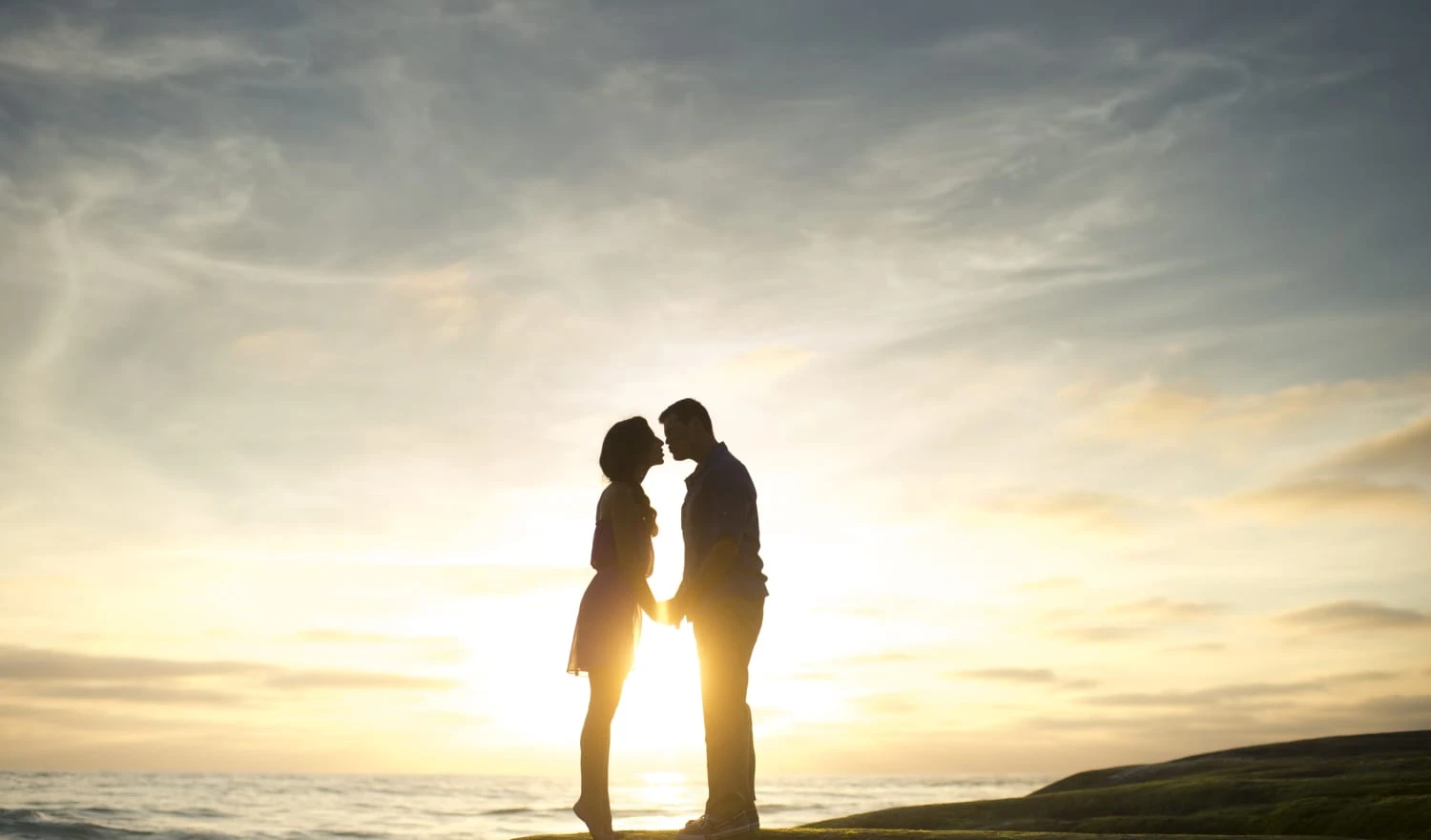 Couple kissing at dawn