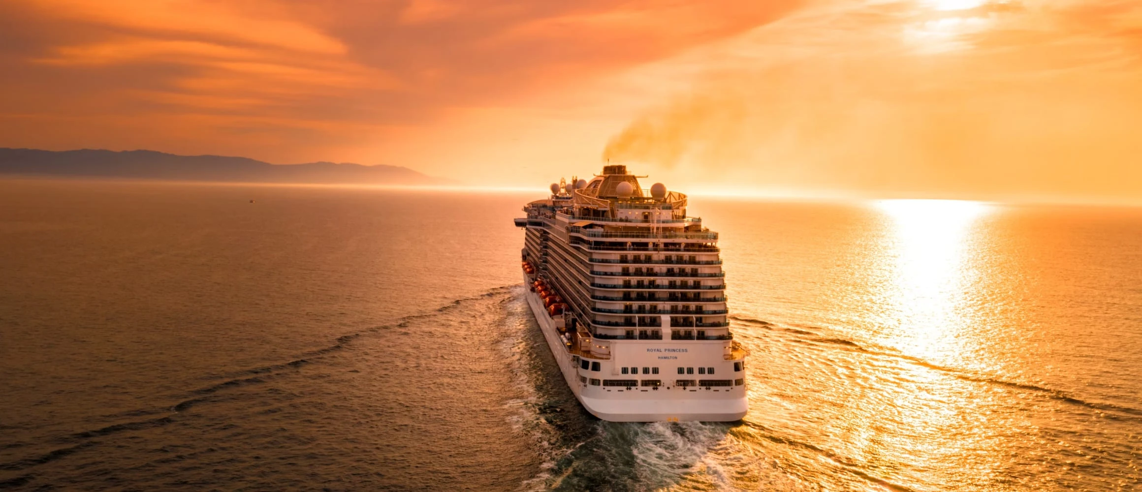 A cruise ship at sunset