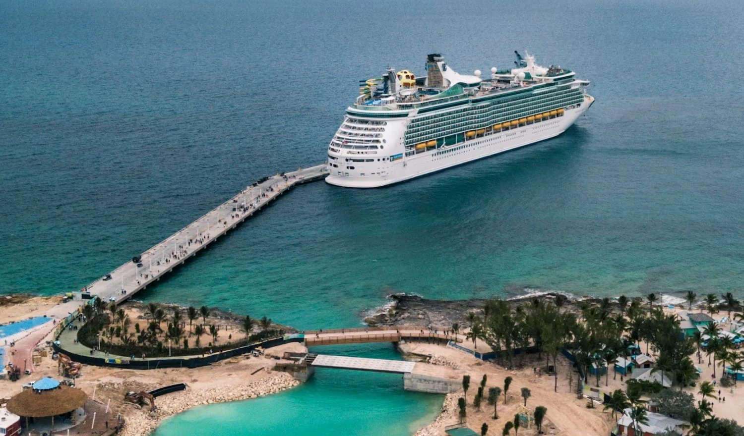 Cruise ship docked at a beautiful location