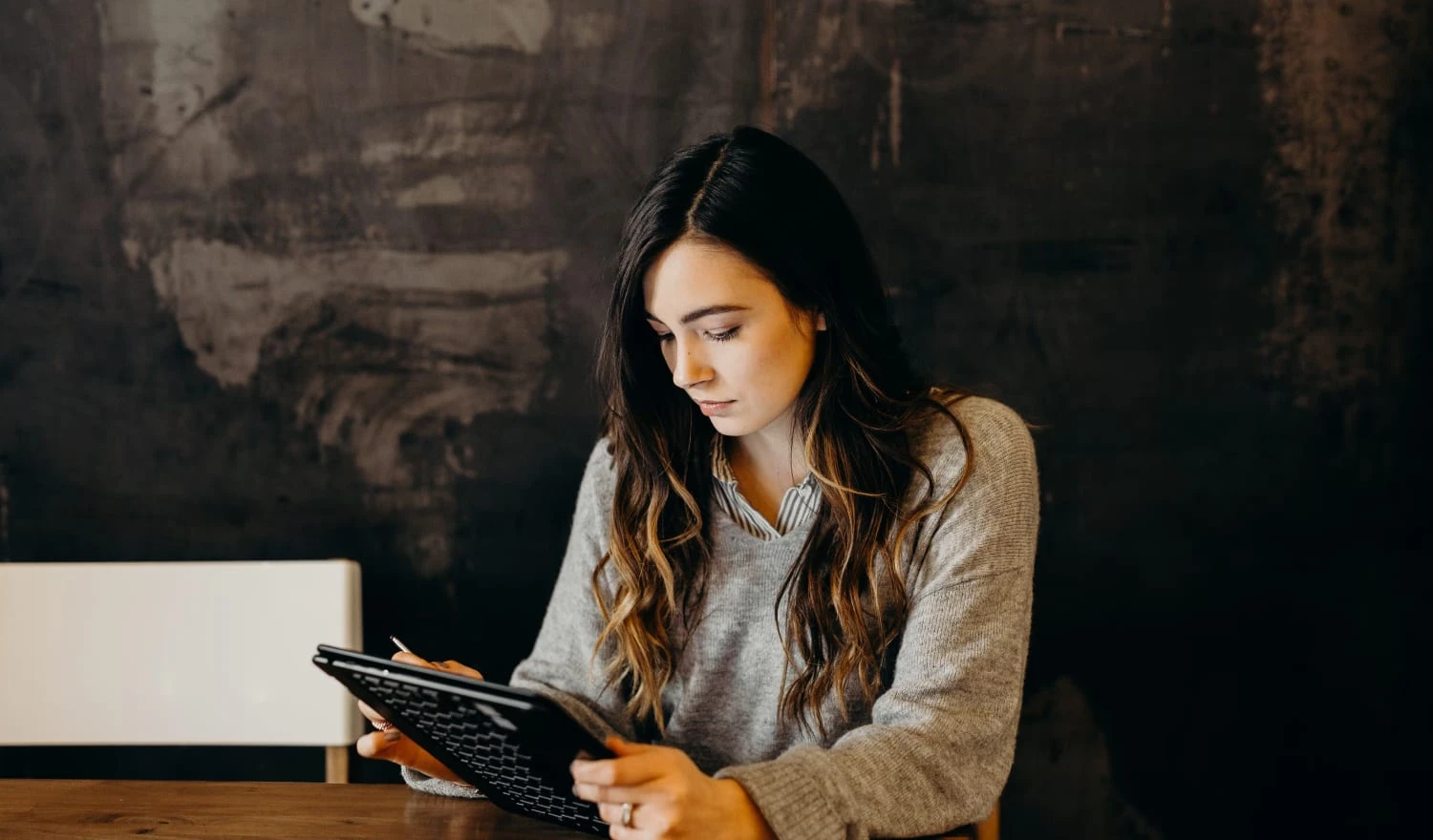 A woman looking at her device