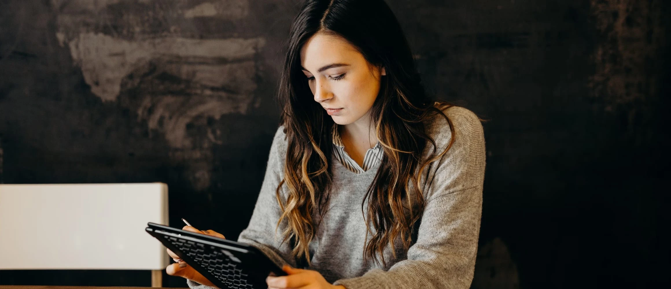 A woman looking at her device