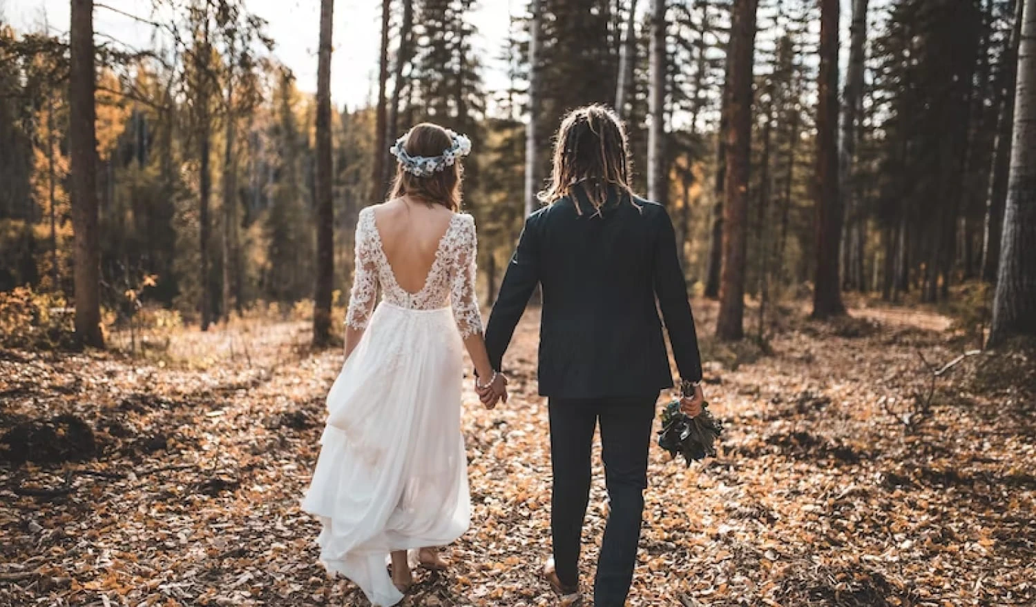 A couple walking into the woods