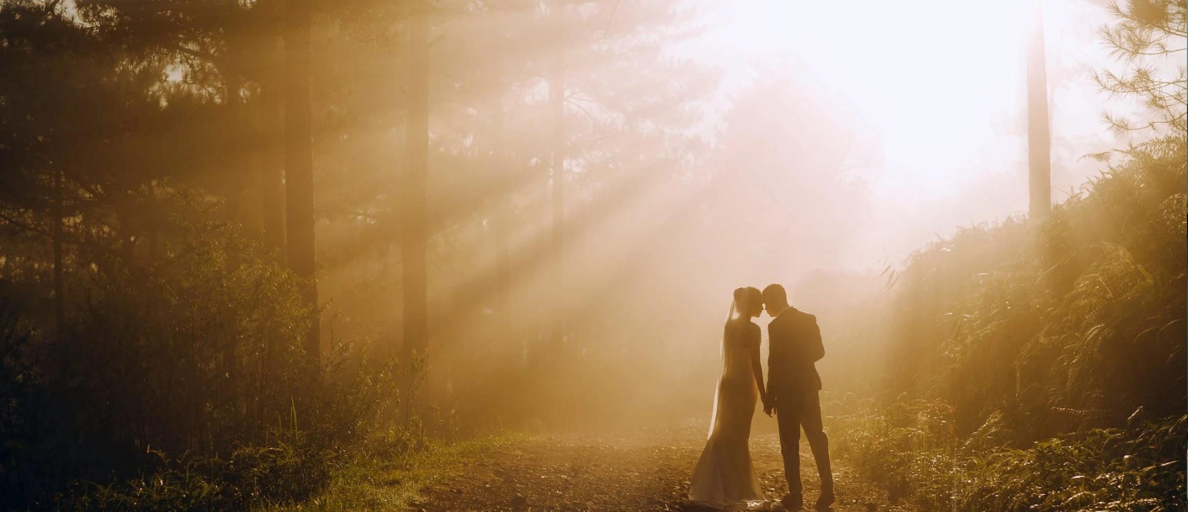 Couple standing in a ray of light