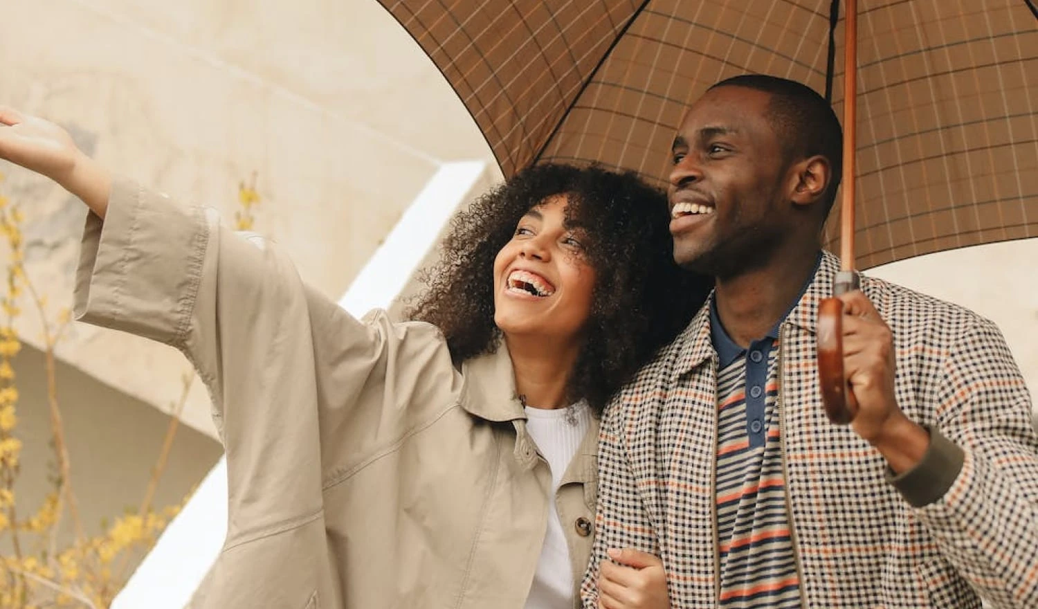 A couple happy in the rain