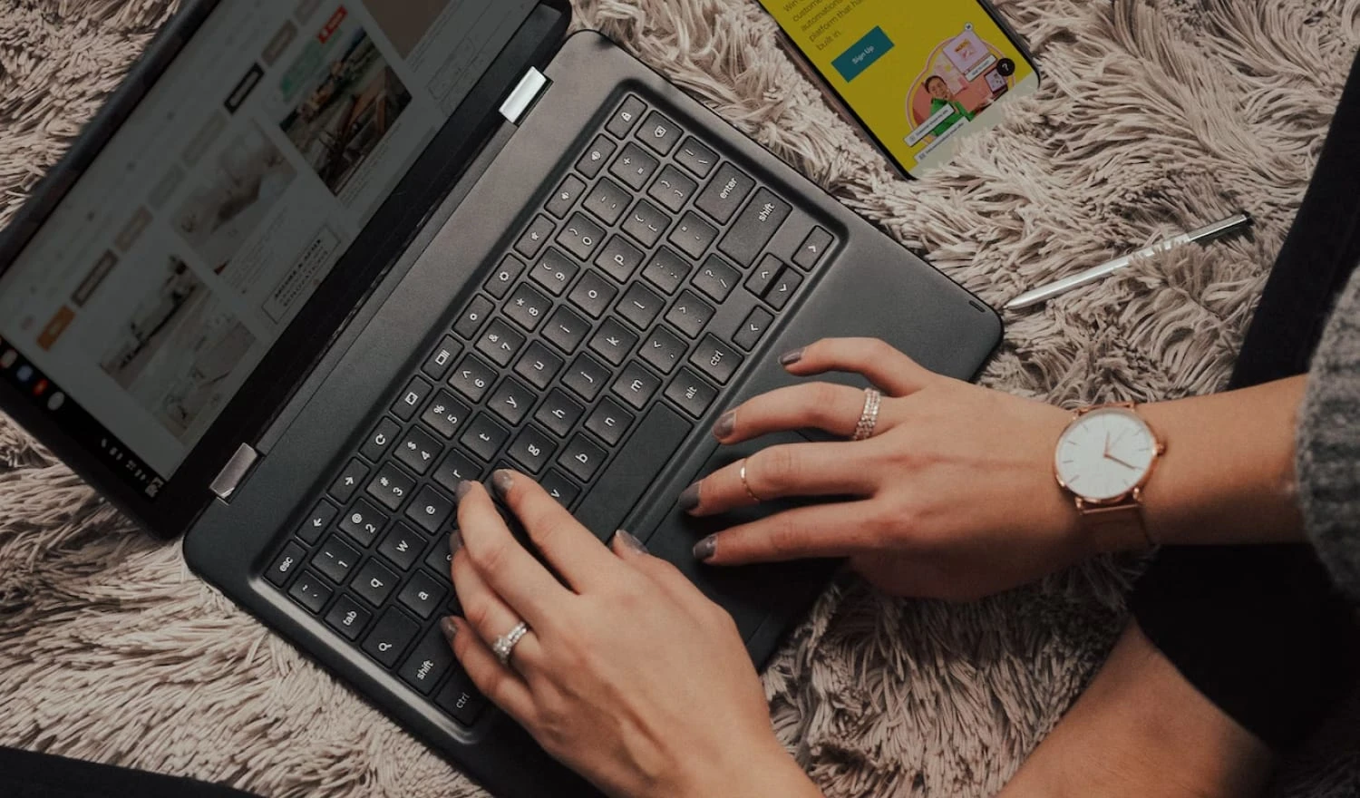 A woman creating a wedding website on her laptop