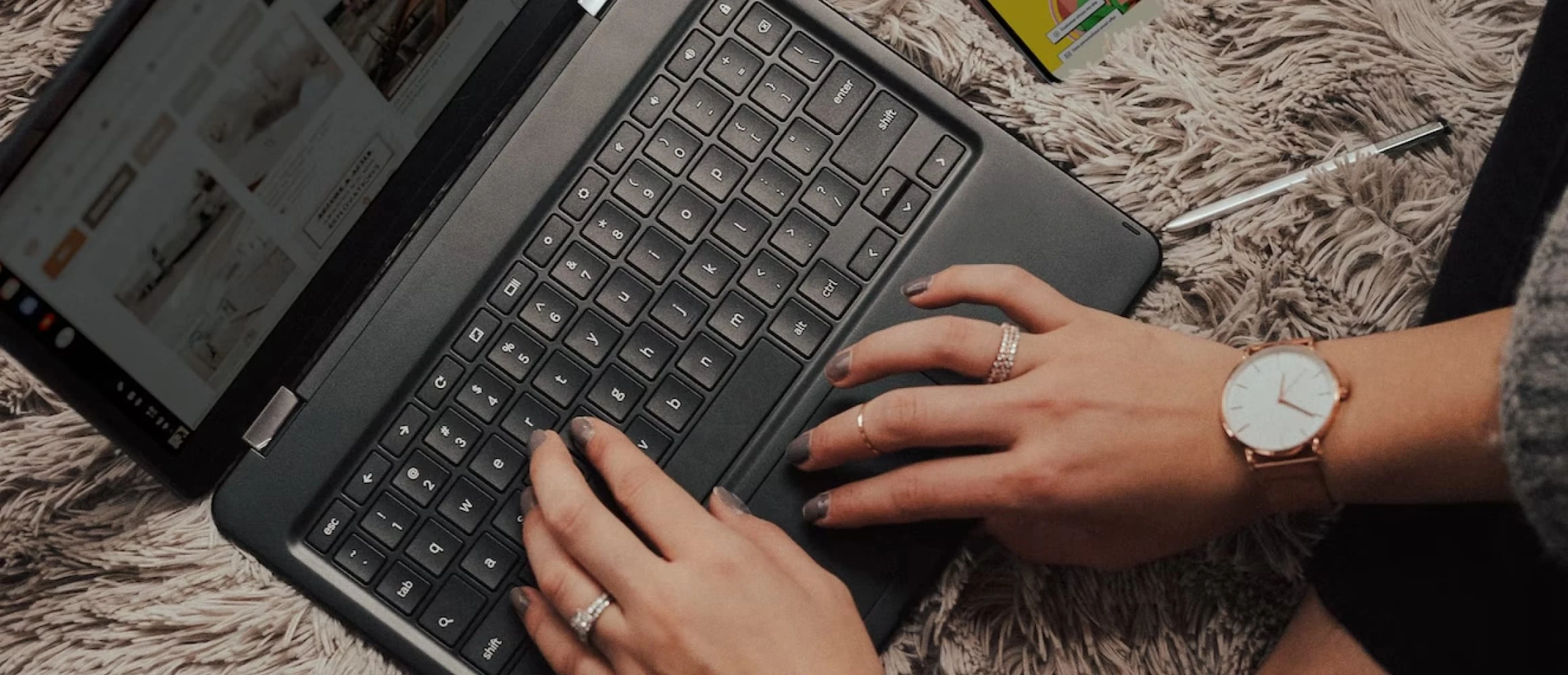 A woman creating a wedding website on her laptop