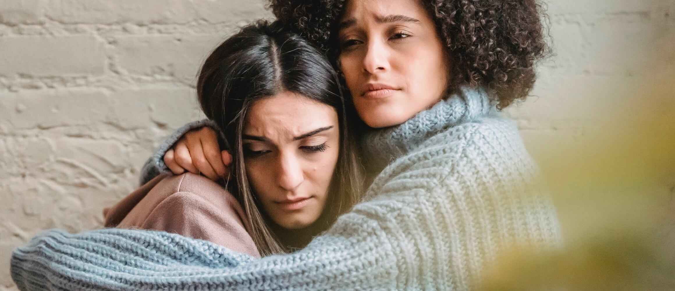 Two women looking dissapointed