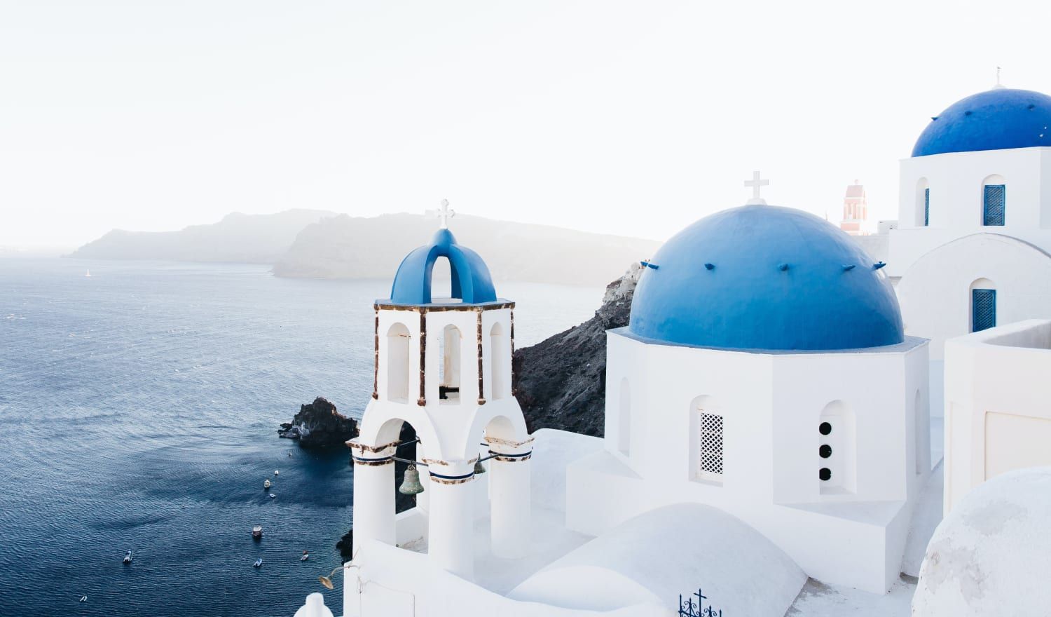 Stunning views overlooking the white and blue domes of Santorini