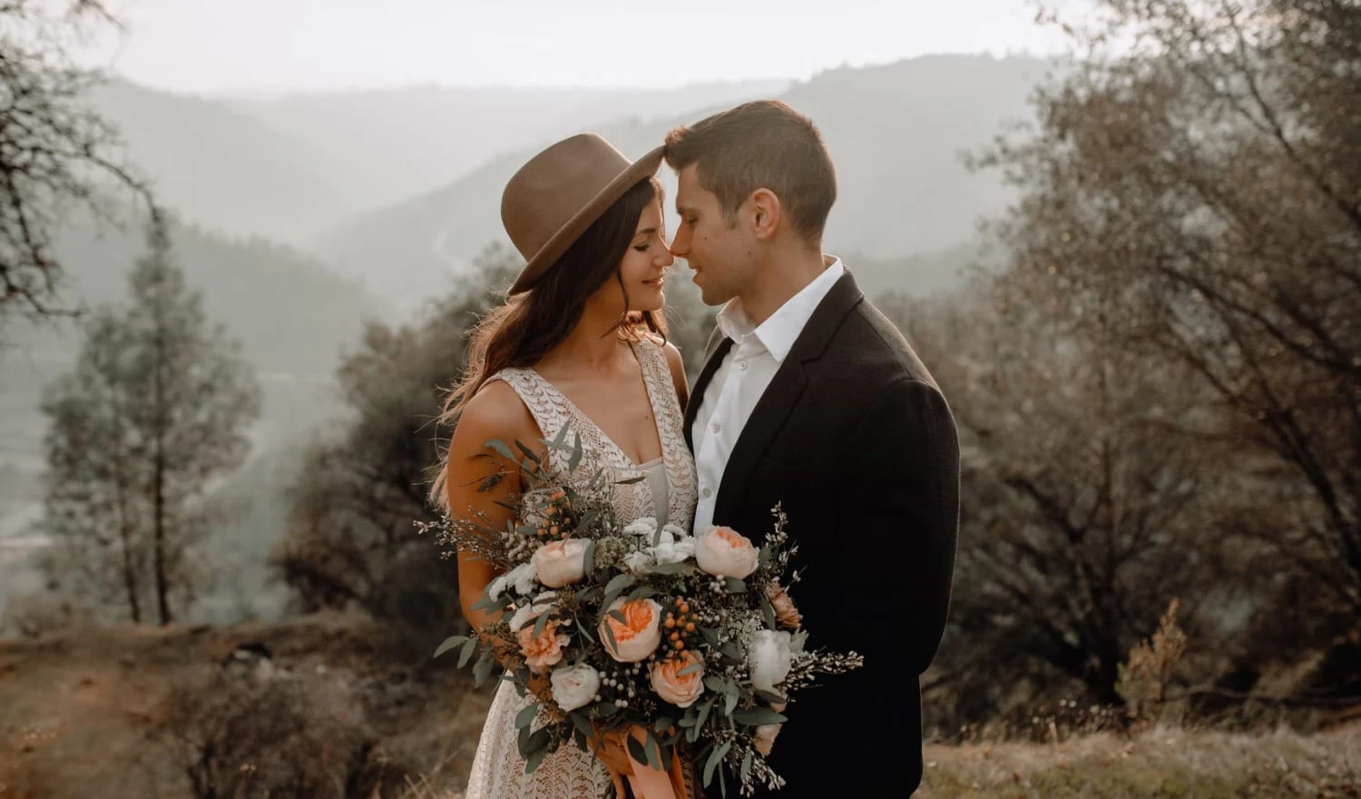 Modern newlyweds standing in a field