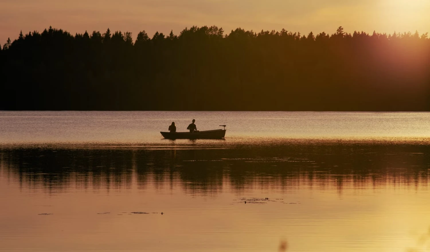 A couple paddling a boat