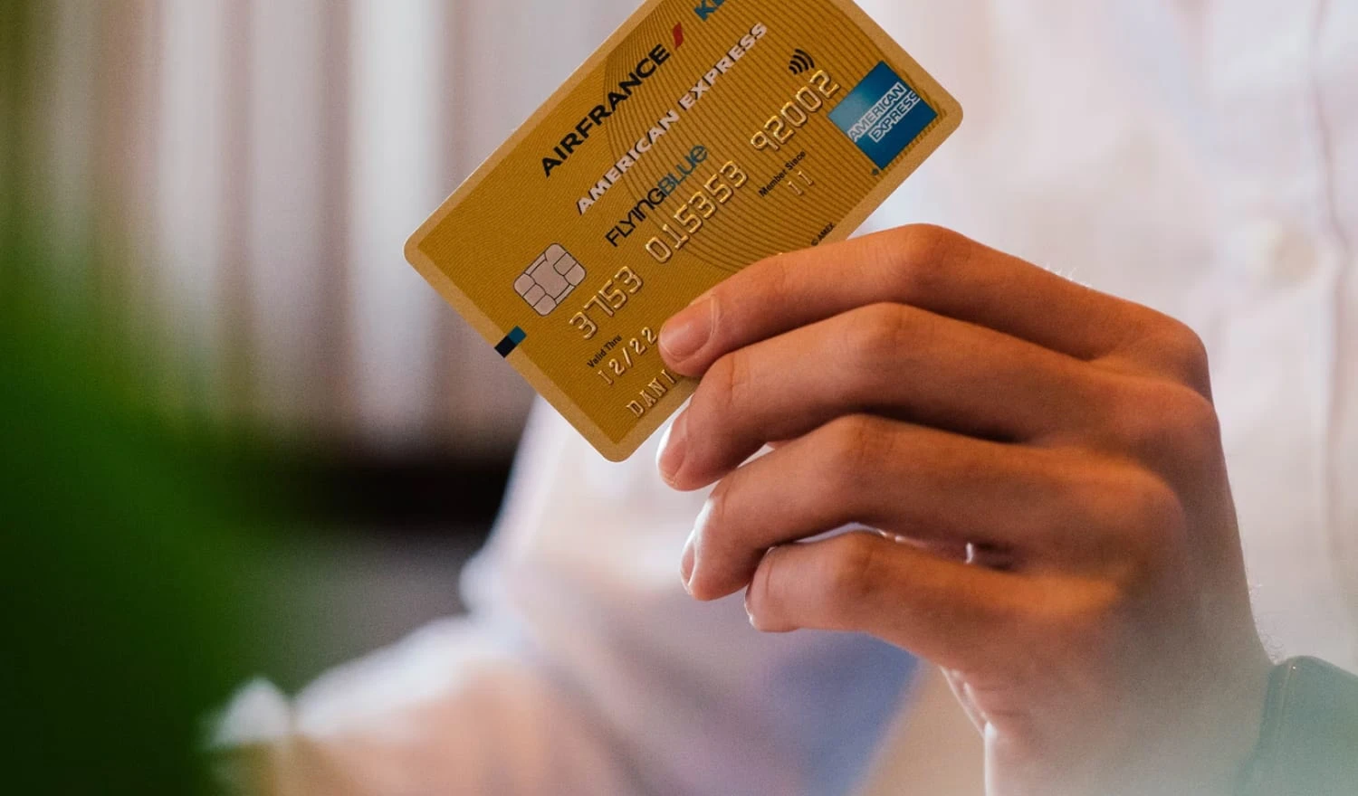 A man holding a credit card