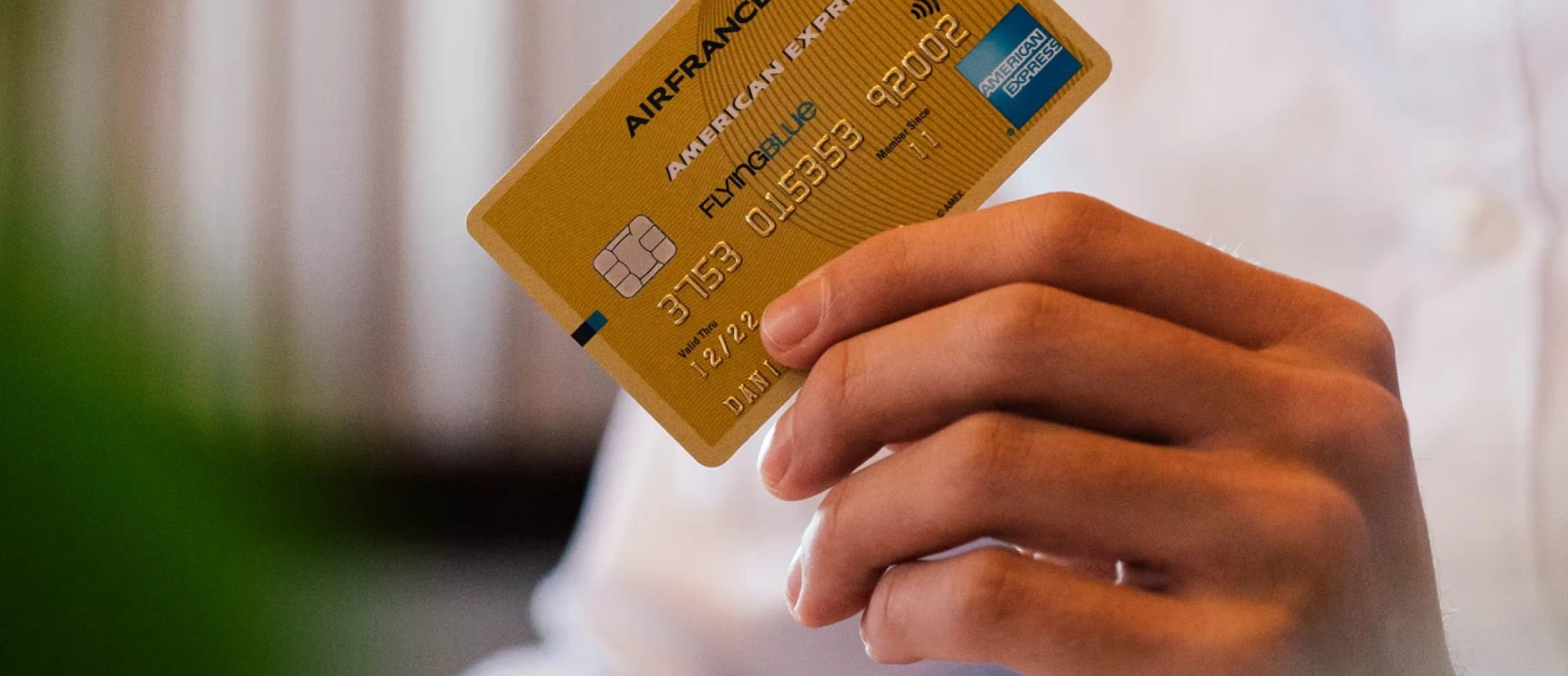 A man holding a credit card