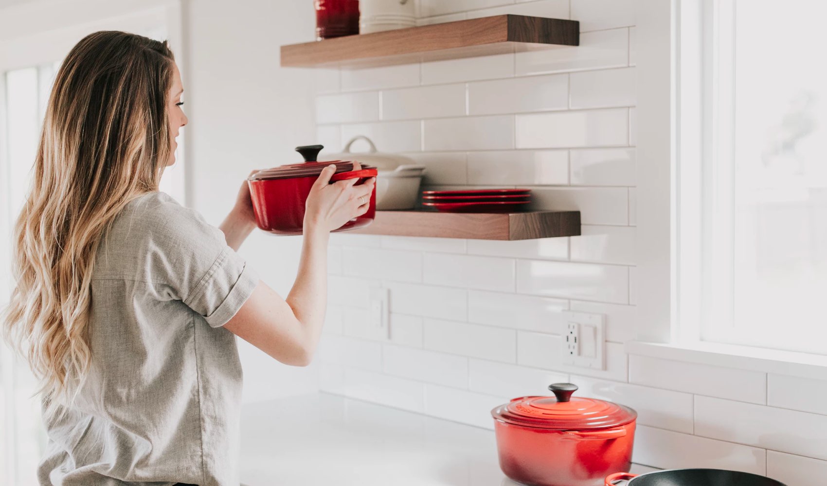 A woman handling kitchenware