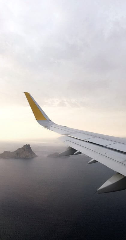 View out of an airplane over islands below