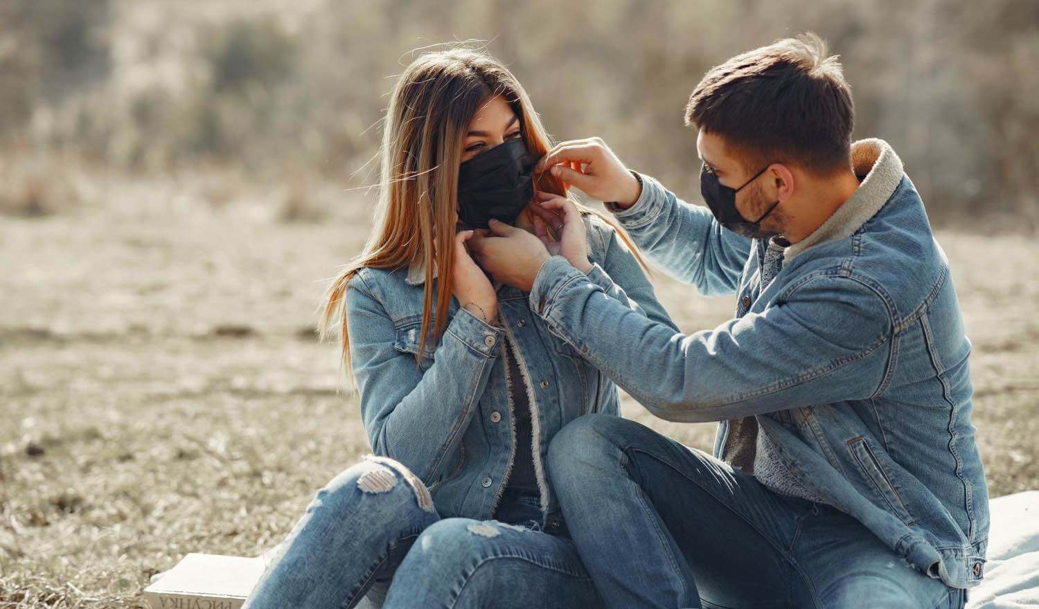 lovers adjusting their COVID masks