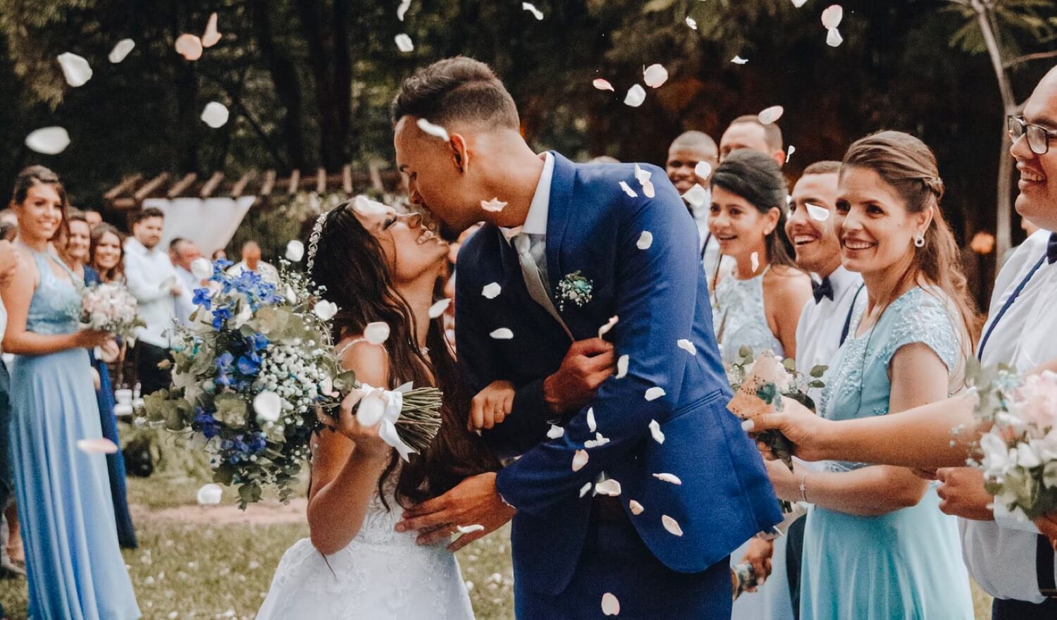 Lovers kissing down the isle