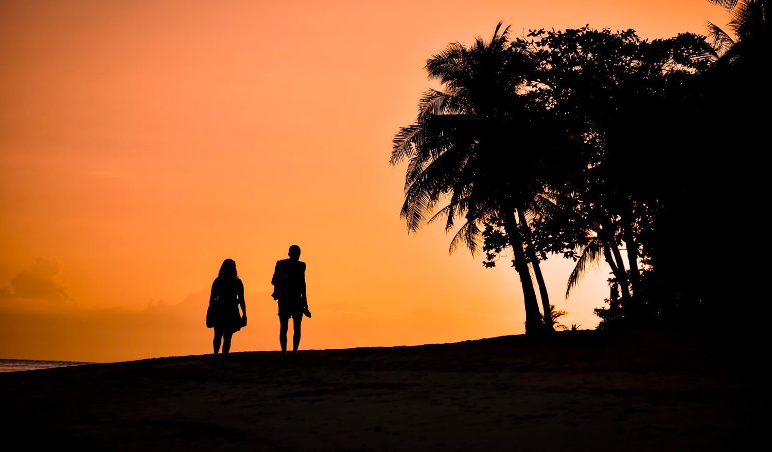 Outline of a couple at sunset