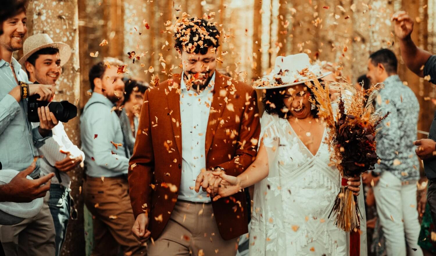 A couple being showered in confetti
