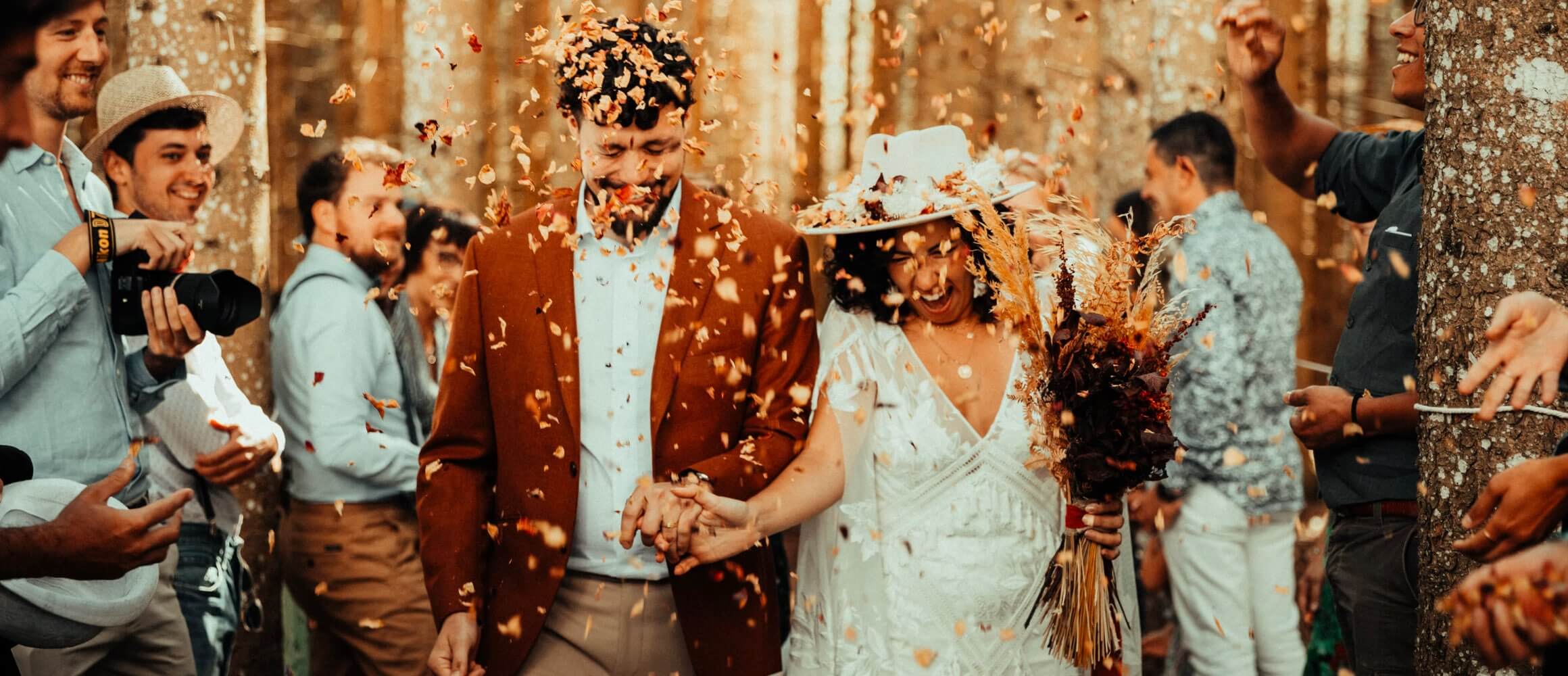 A couple being showered in confetti