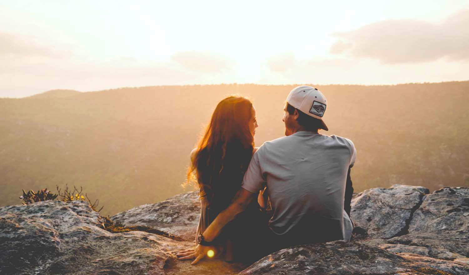 A woman and man gazing into the distance