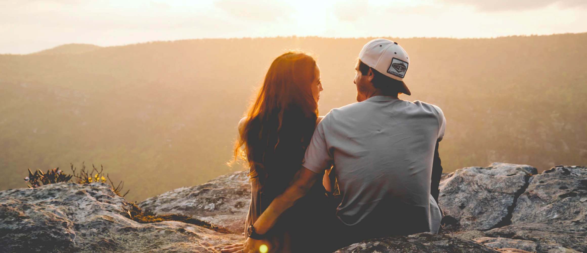 A woman and man gazing into the distance