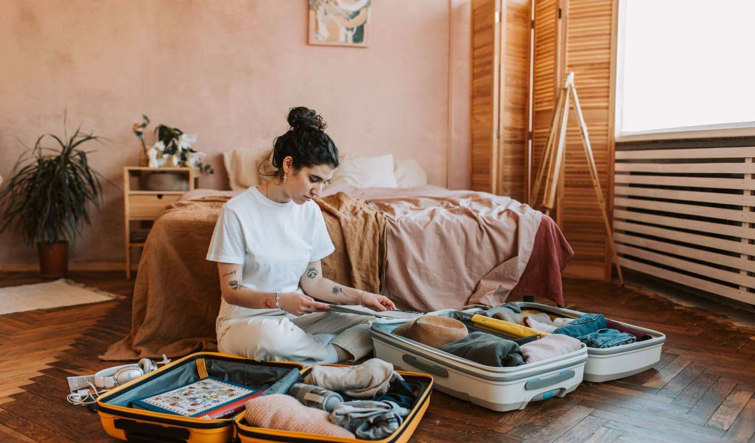 Packing clothes in to a suitcase to start travelling