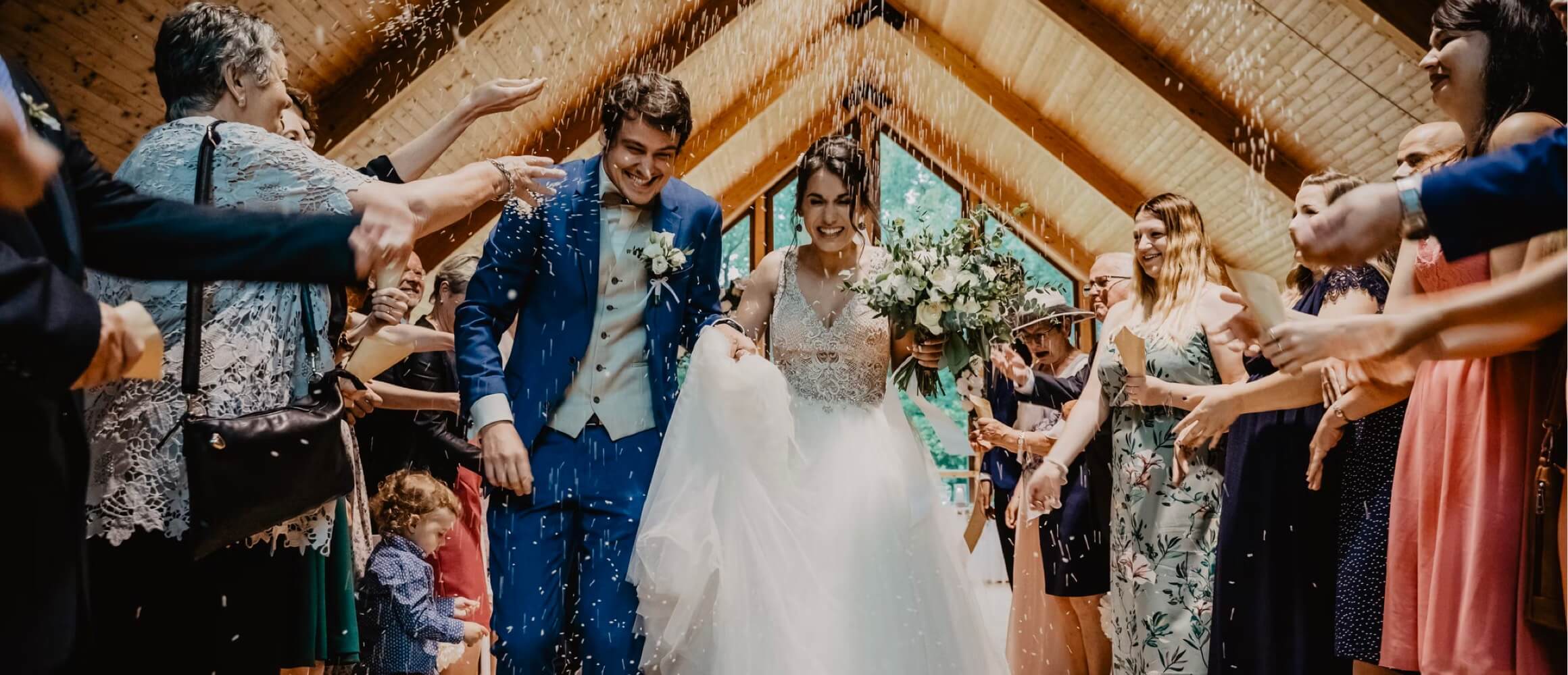 A couple being showered with confetti