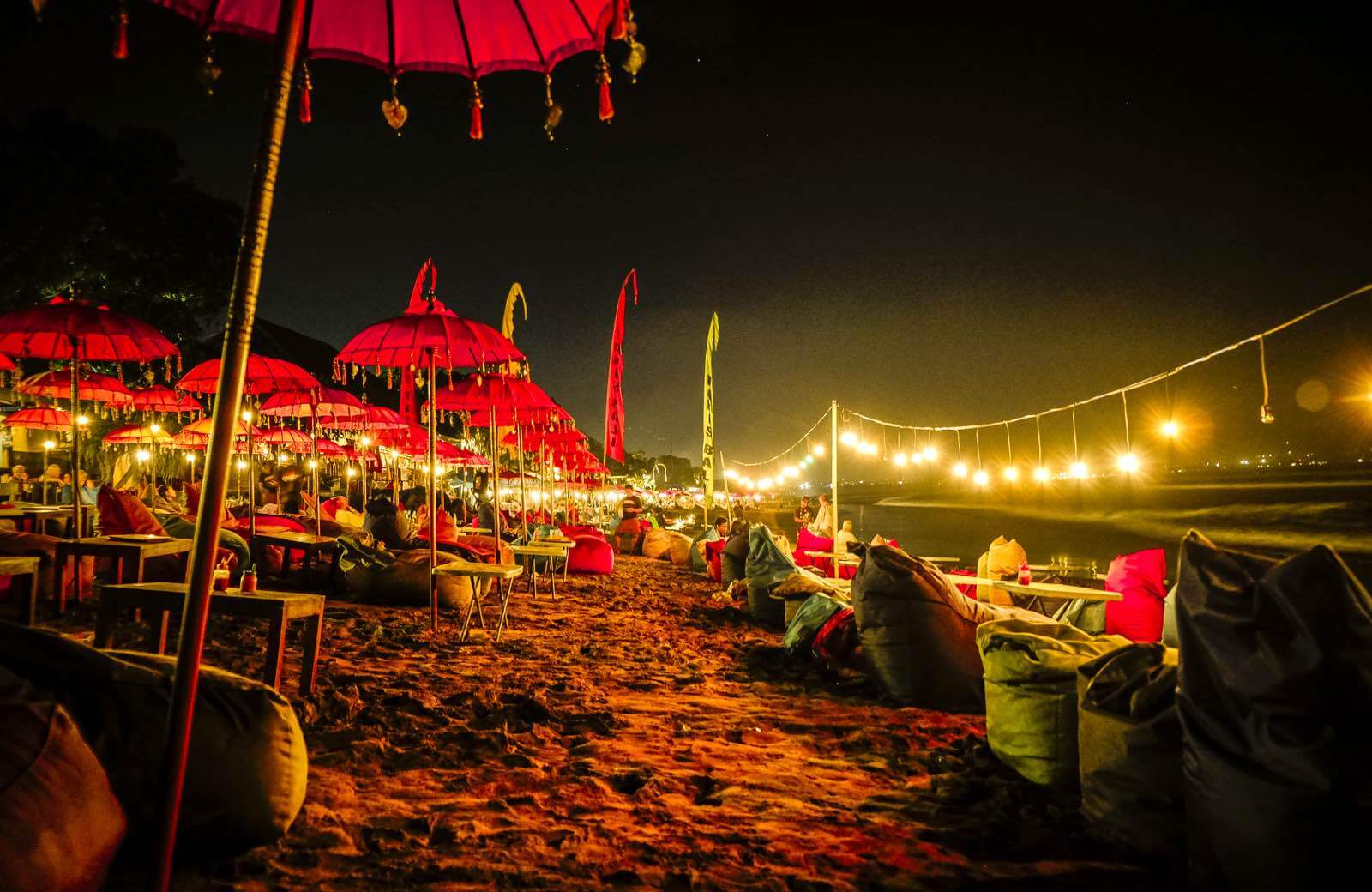 Red umbrellas on Seminyak beach