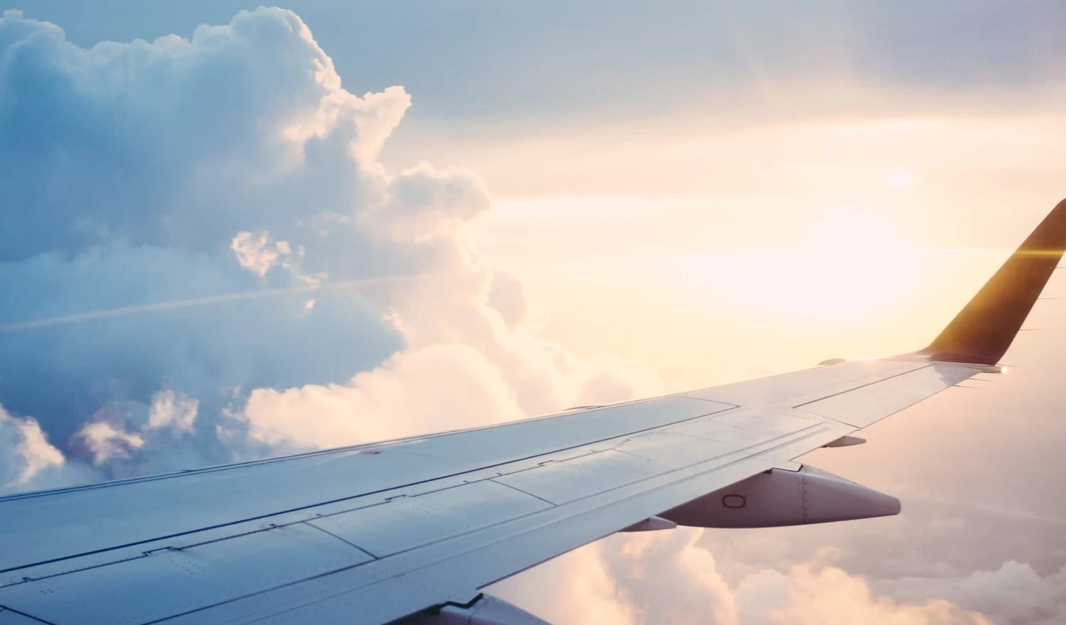 View of yellow clouds from a plane window