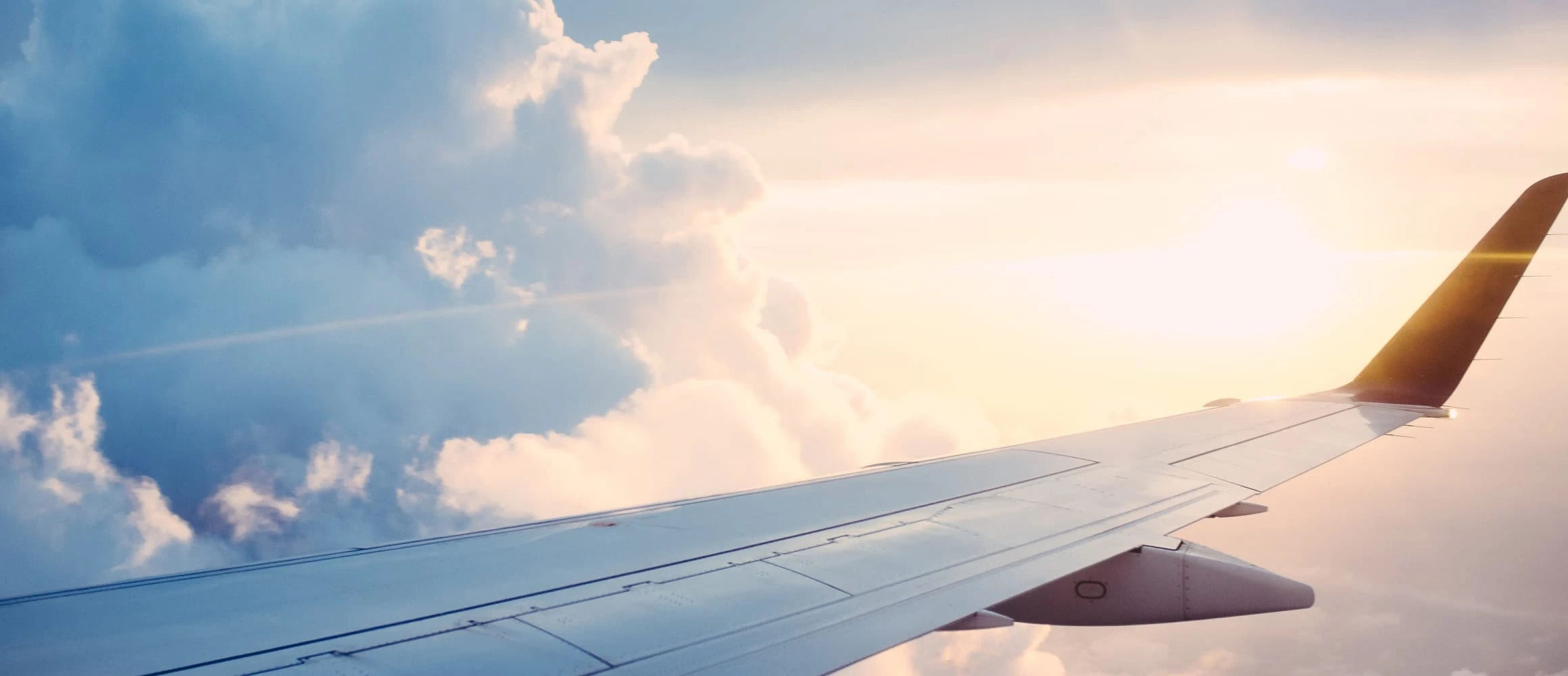 View of yellow clouds from a plane window