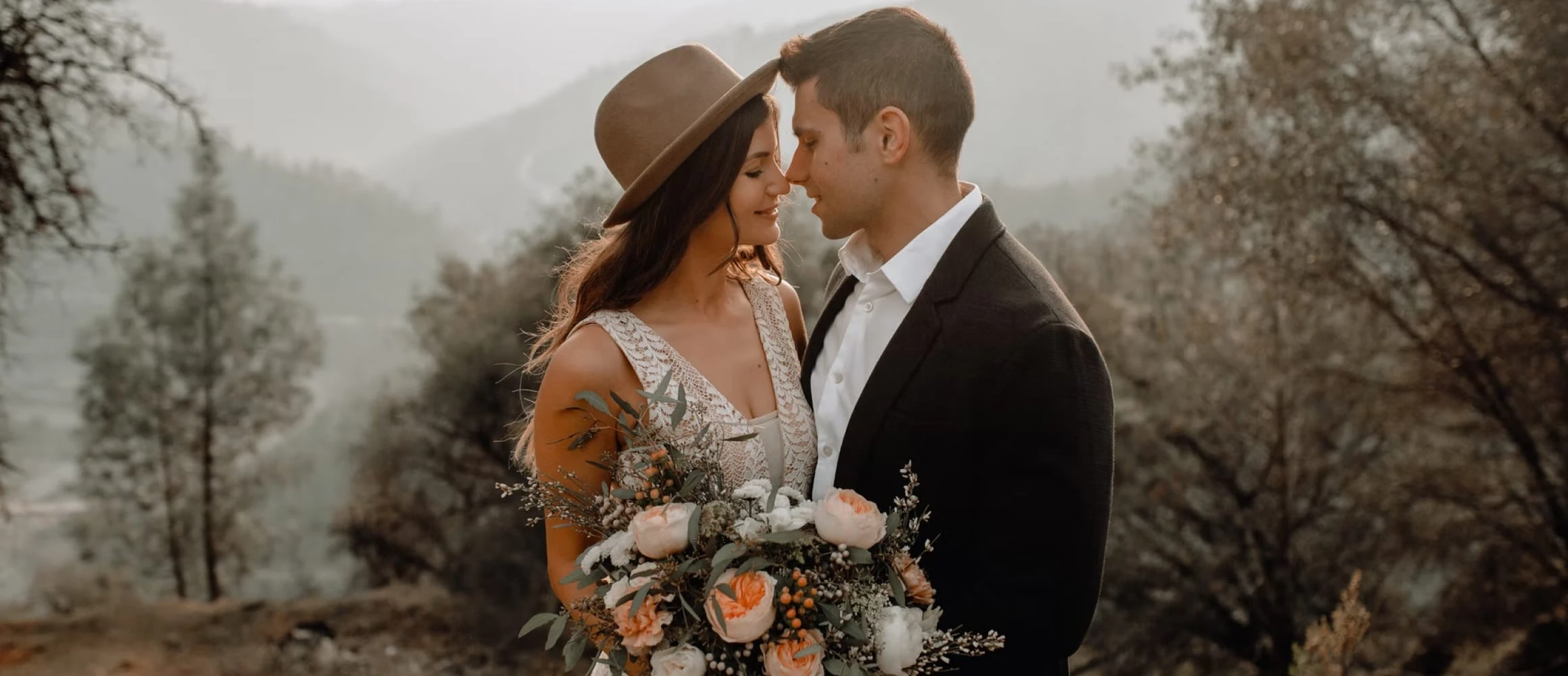 Modern newlyweds standing in a field