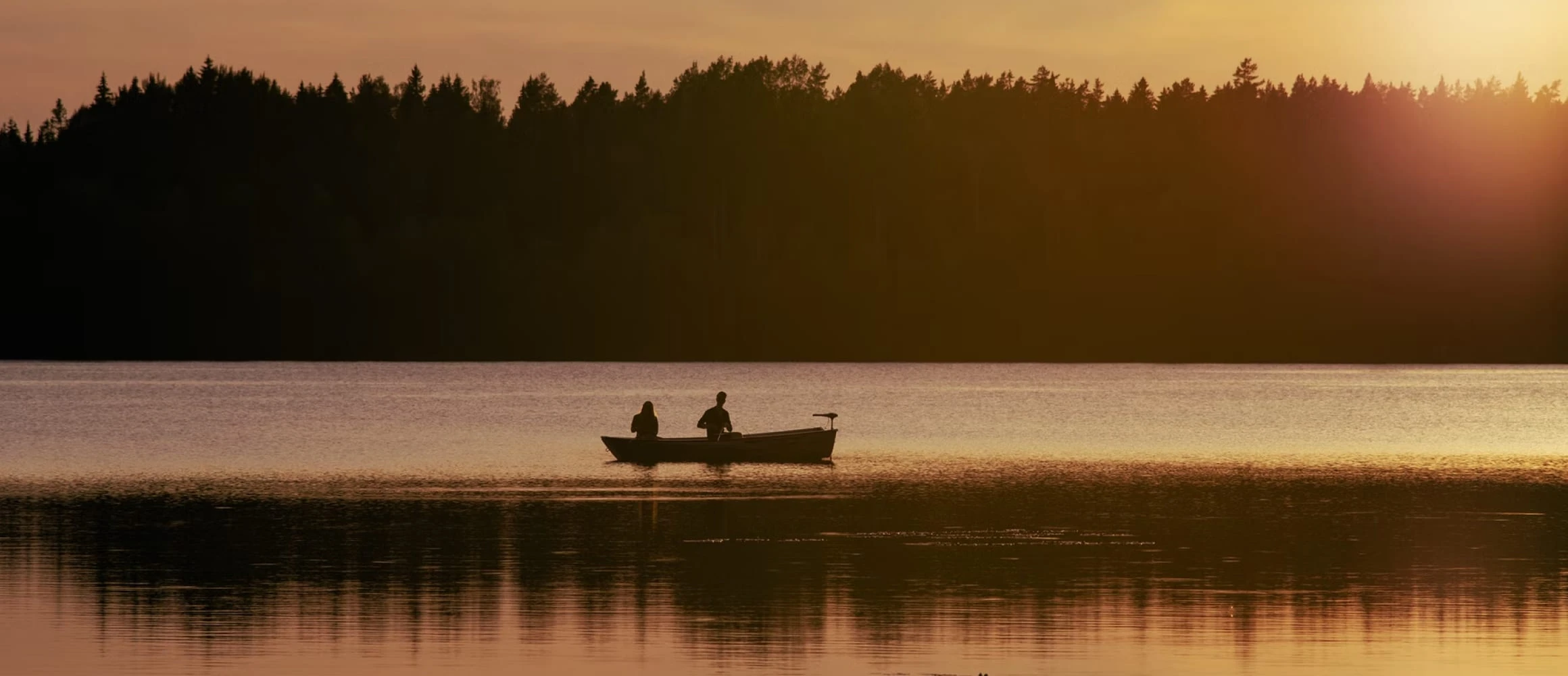 A couple paddling a boat