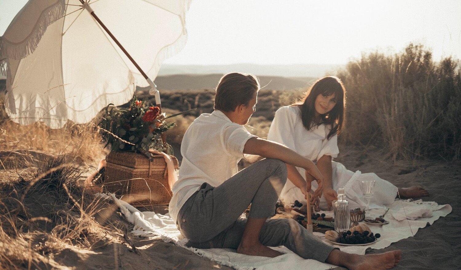 Couple enjoying a picnic on the beach