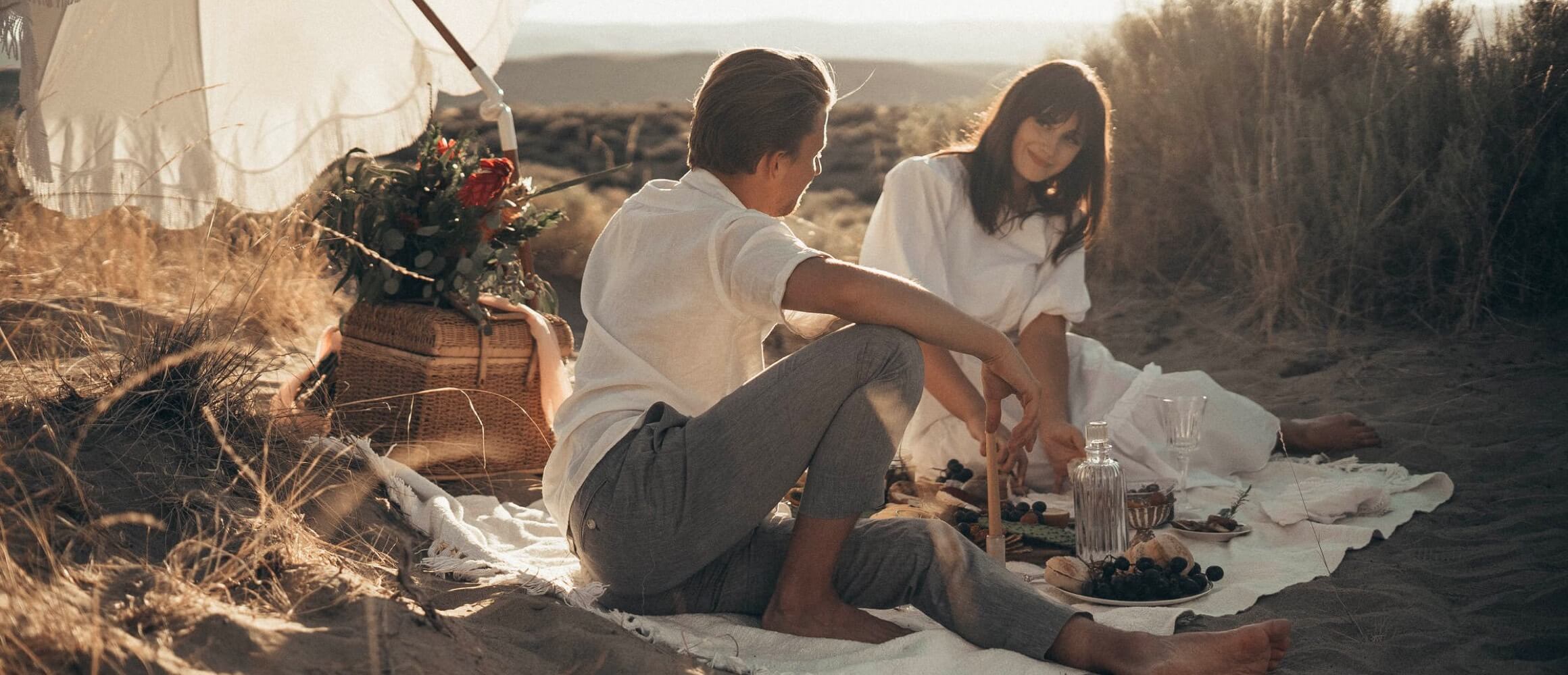 Couple enjoying a picnic on the beach