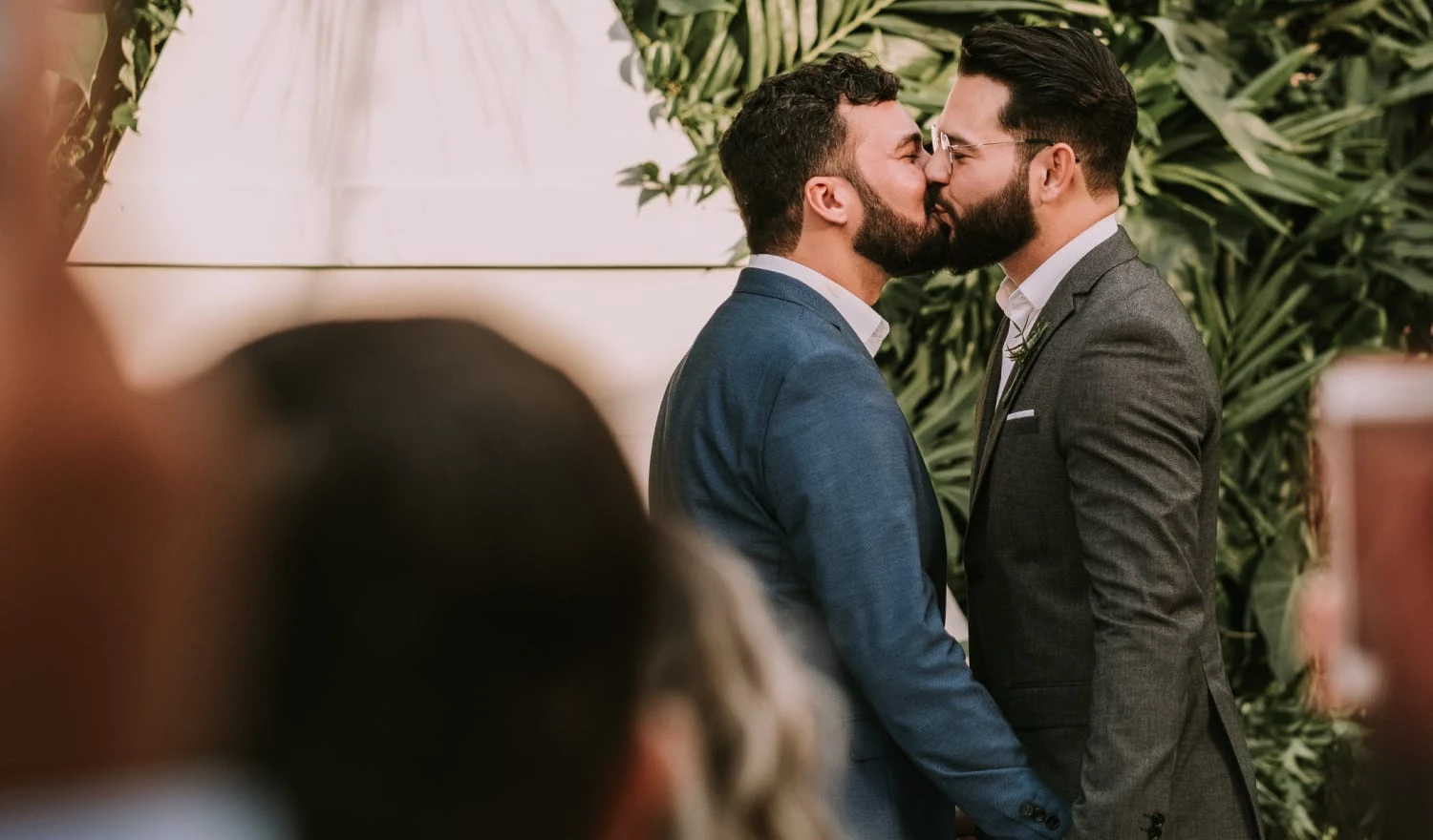 Couple kissing at the alter