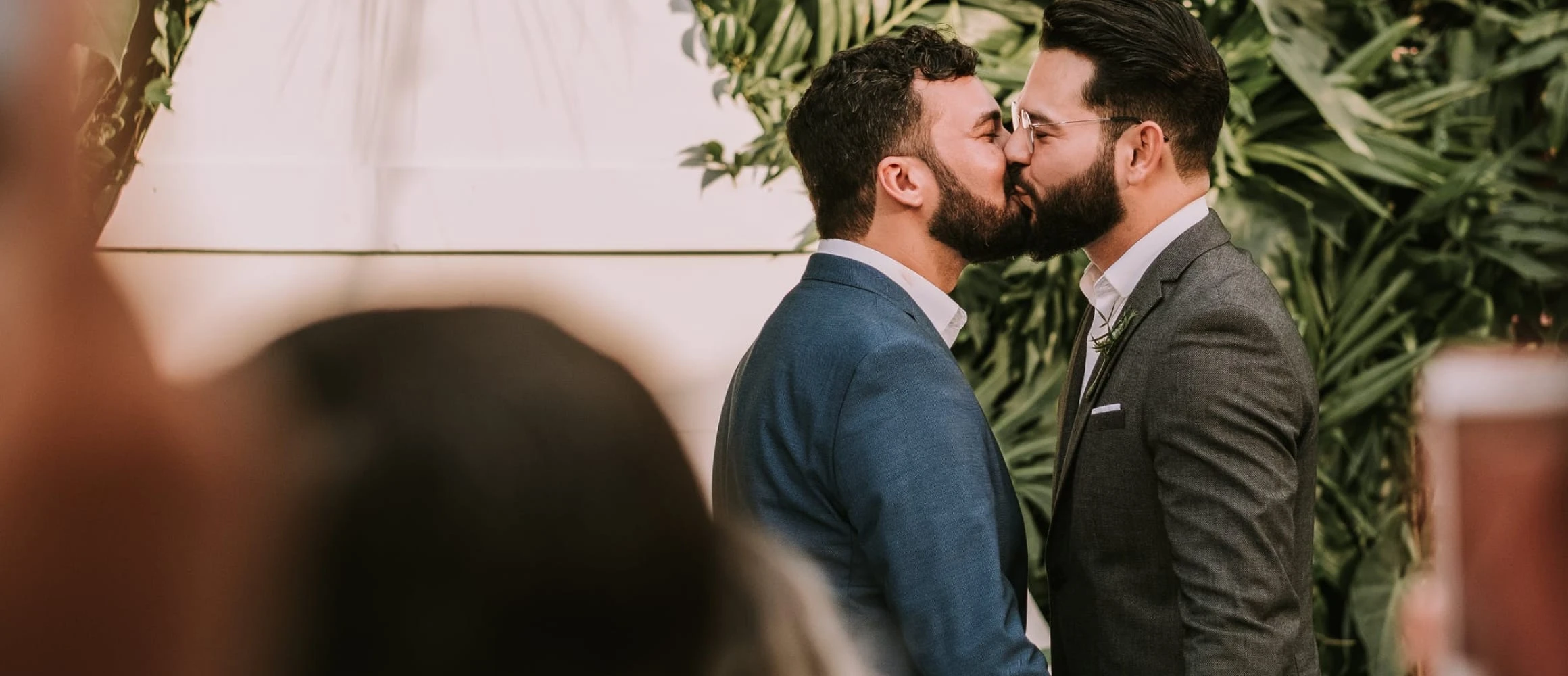 Couple kissing at the alter