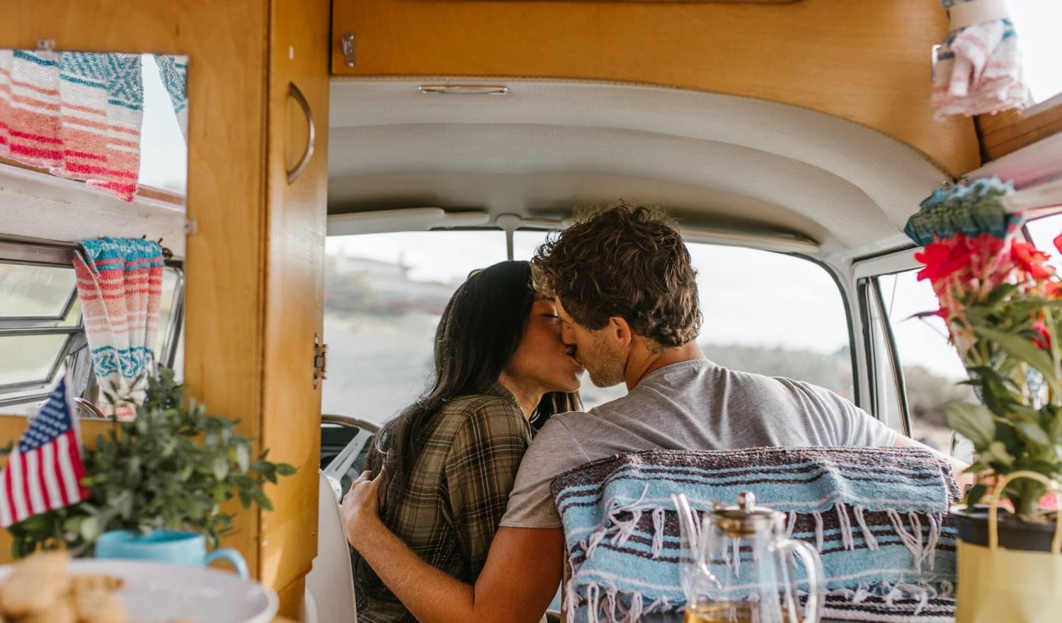 A wanderlust couple campervanning on their honeymoon.