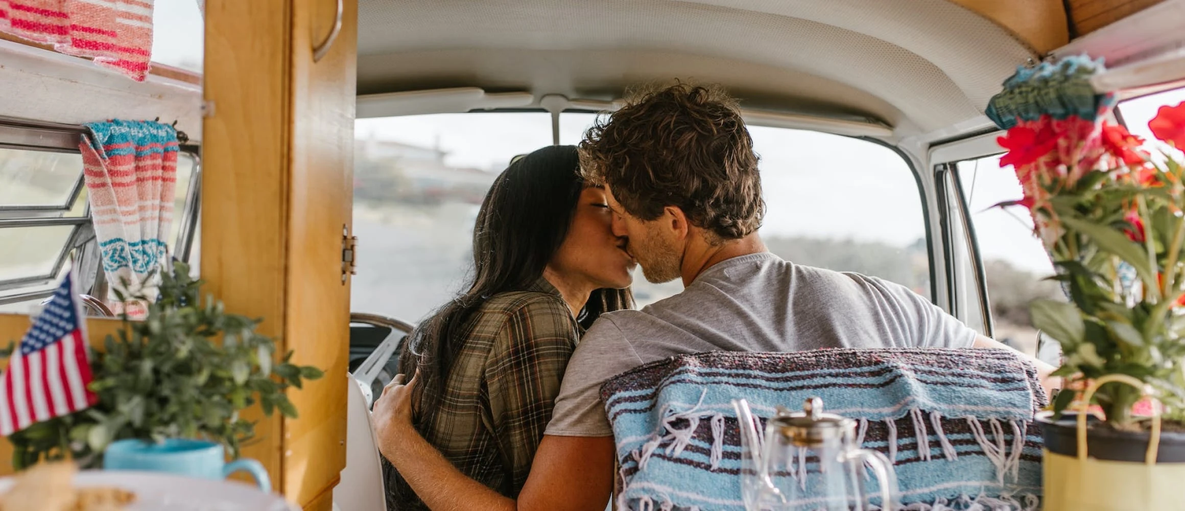 A wanderlust couple campervanning on their honeymoon.